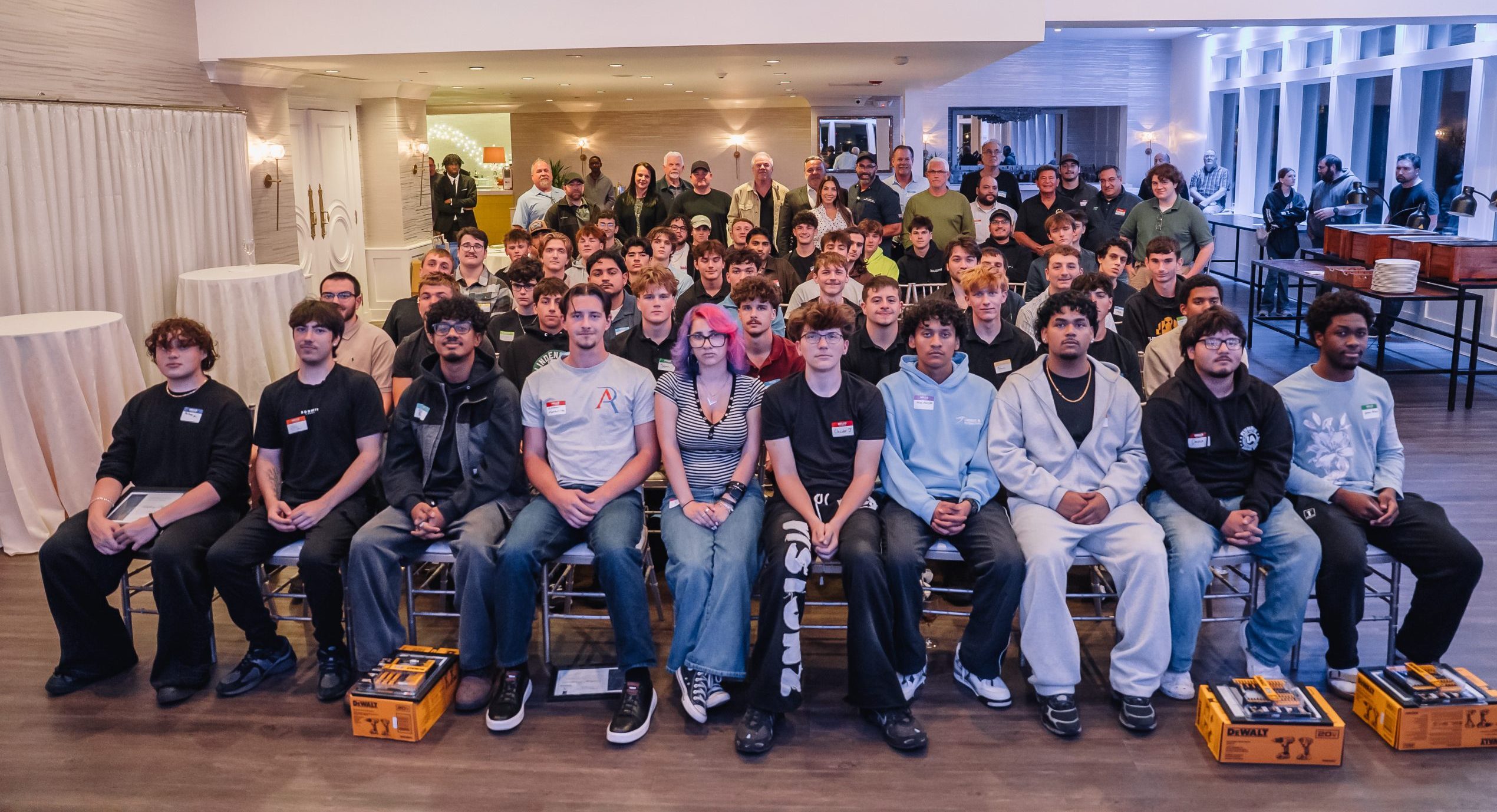 Group photo of students, mentors and local business owners at the most recent monthly meeting